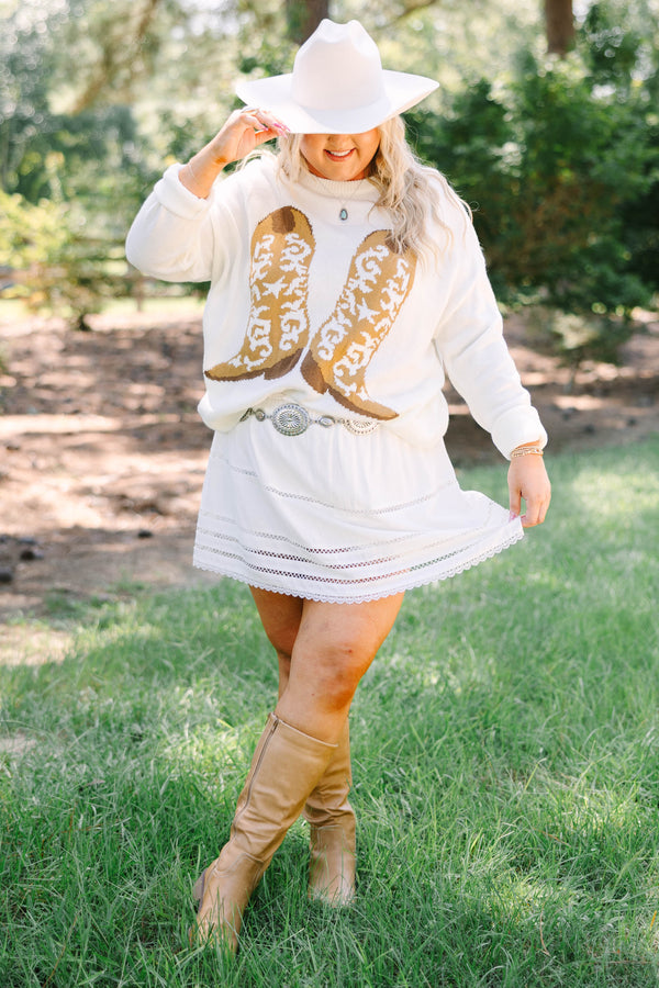 Plus Size ivory knit sweater featuring a crew neckline and a tan western boot graphic on the front.