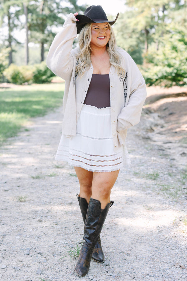 Plus Size tan knit cardigan with horse embroidery, button front, and long sleeves.