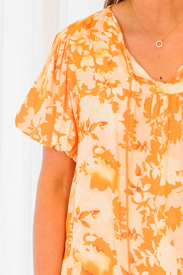 Chic Soul plus size clothing, short sleeve orange top with darker orange floral pattern and orange tassels