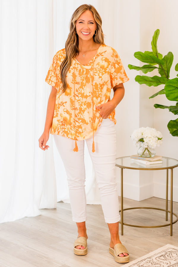 Chic Soul plus size clothing, short sleeve orange top with darker orange floral pattern and orange tassels
