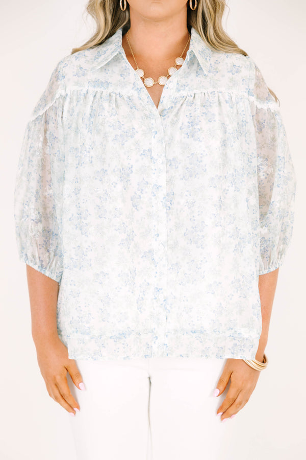 Plus Size blue and white floral button-down blouse with puff sleeves and a collared neckline.
