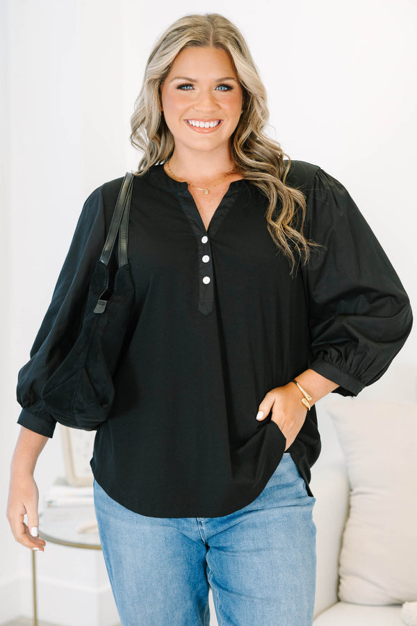 Plus Size black henley top with three-quarter puff sleeves, a button-up neckline, and a relaxed fit.
