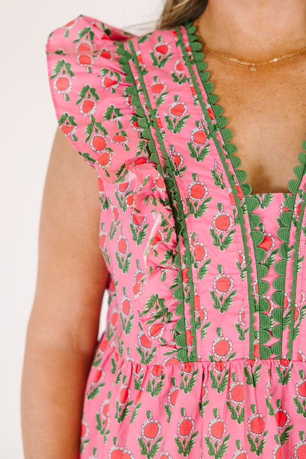 Chic Soul plus size clothing, pink top with flutter sleeves and a pink and green floral pattern as well as green scalloped detailing going along the v-neckline and the sides of the neckline 