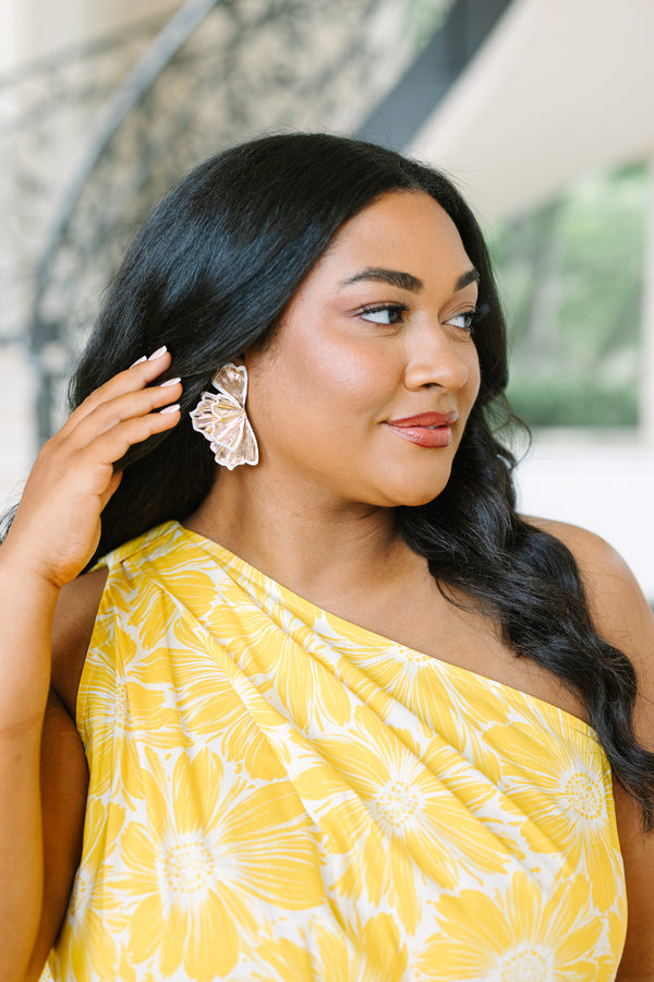 Plus Size gold fan-shaped statement earrings with white enamel trim and a textured metallic finish.