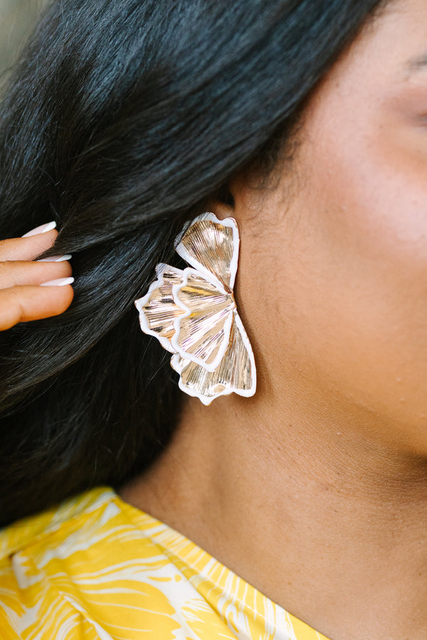 Plus Size gold fan-shaped statement earrings with white enamel trim and a textured metallic finish.