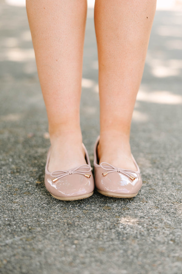 Plus Size blush patent leather ballet flats with a round toe and a delicate bow detail.