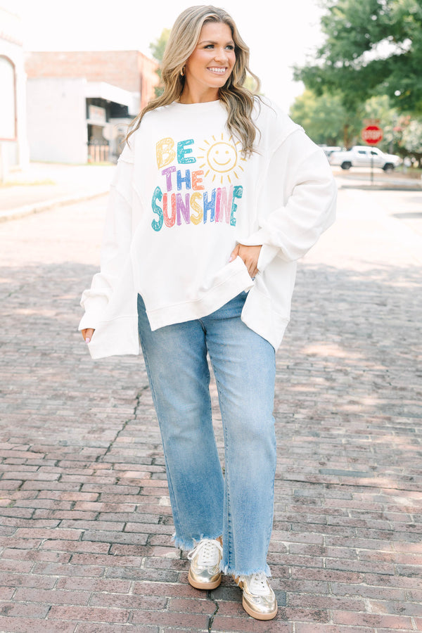 Plus size ivory crew neck pullover with colorful 'be the sunshine' graphic