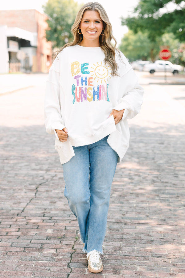 Plus size ivory crew neck pullover with colorful 'be the sunshine' graphic