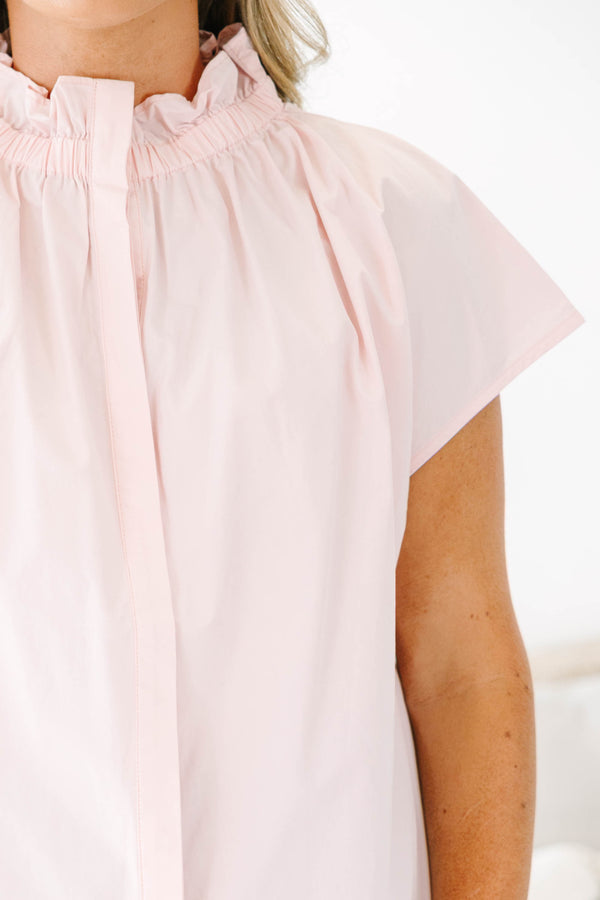 Plus Size light pink short sleeve top with a ruffled high neckline and hidden button placket.