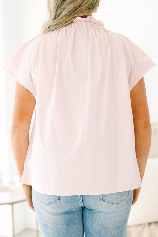 Plus Size light pink short sleeve top with a ruffled high neckline and hidden button placket.