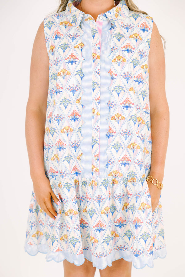 Plus Size cream sleeveless mini dress with a floral diamond print, scalloped trim, and button front.