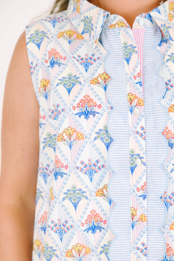 Plus Size cream sleeveless mini dress with a floral diamond print, scalloped trim, and button front.
