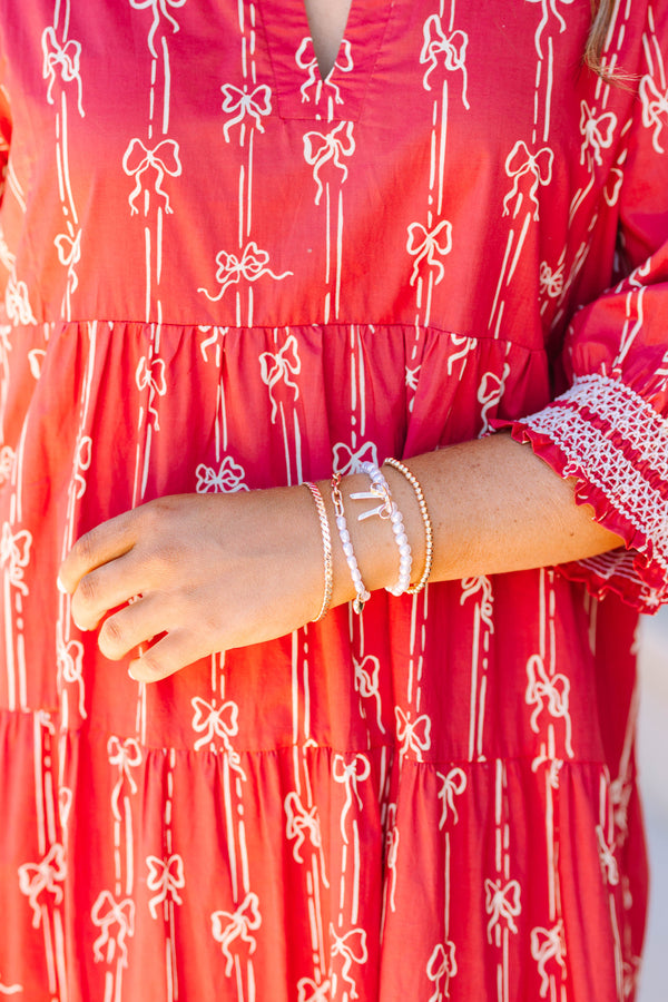 Plus Size gold-tone bracelet set with pearls, a bow charm, and a heart charm on a wrist.