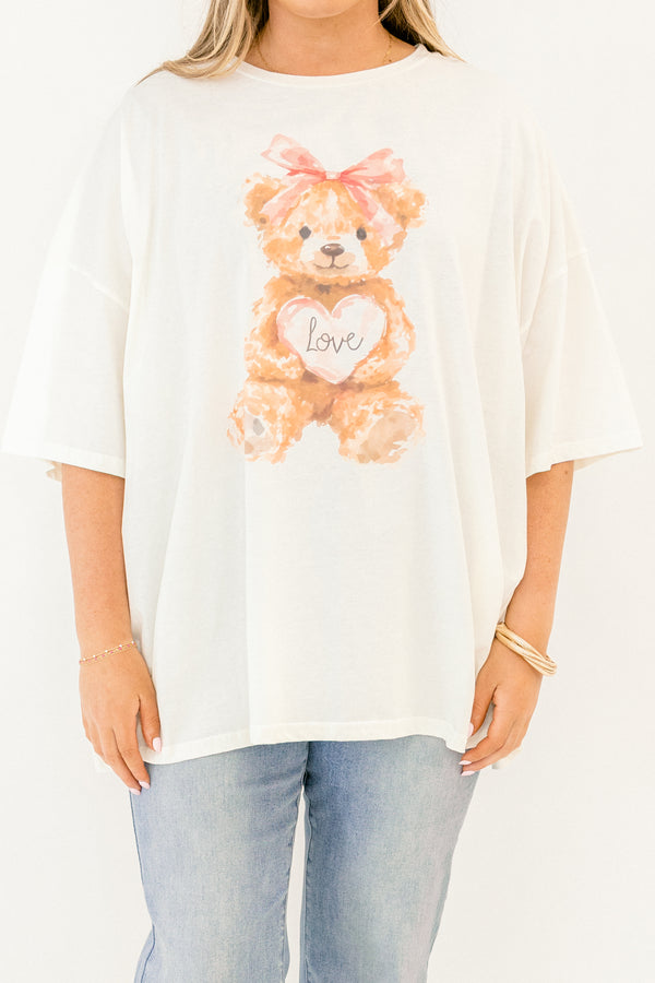 Chic Soul plus size clothing, whtie short sleeve boyfriend tee with light brown teddy bear on the front with pink bow on its head and light pink heart with 