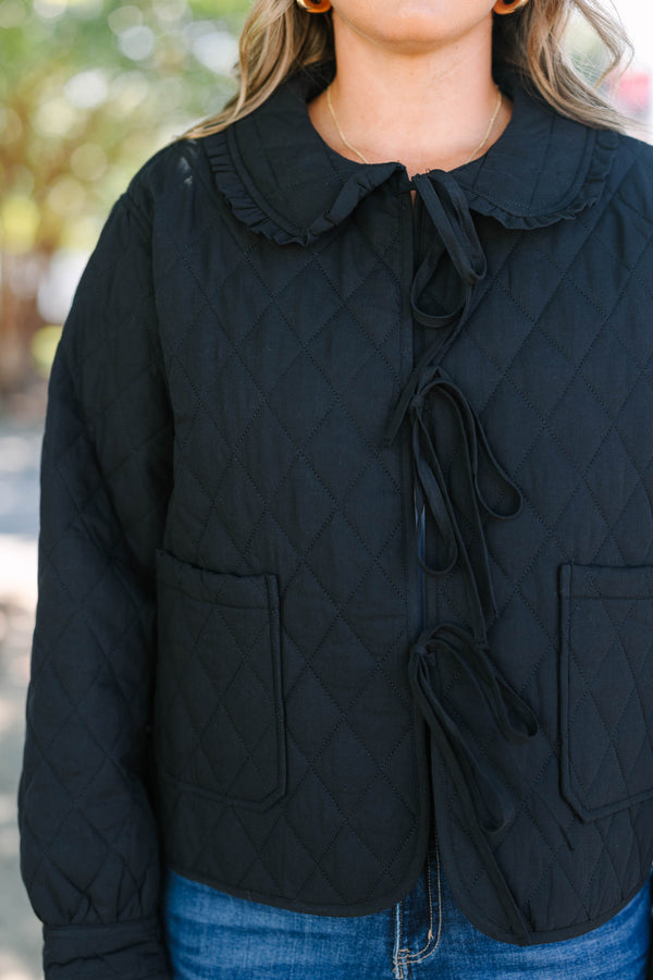 Plus Size black quilted jacket with a ruffled bib collar, three front bow ties, and patch pockets.
