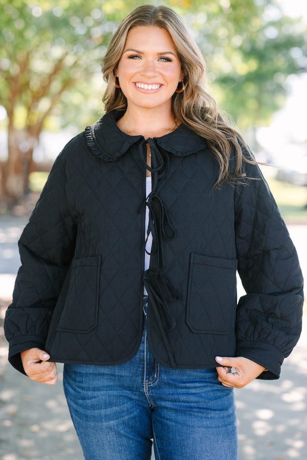Plus Size black quilted jacket with a ruffled bib collar, three front bow ties, and patch pockets.