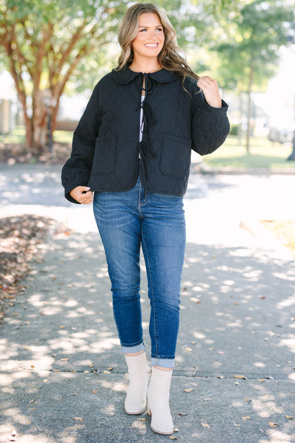 Plus Size black quilted jacket with a ruffled bib collar, three front bow ties, and patch pockets.