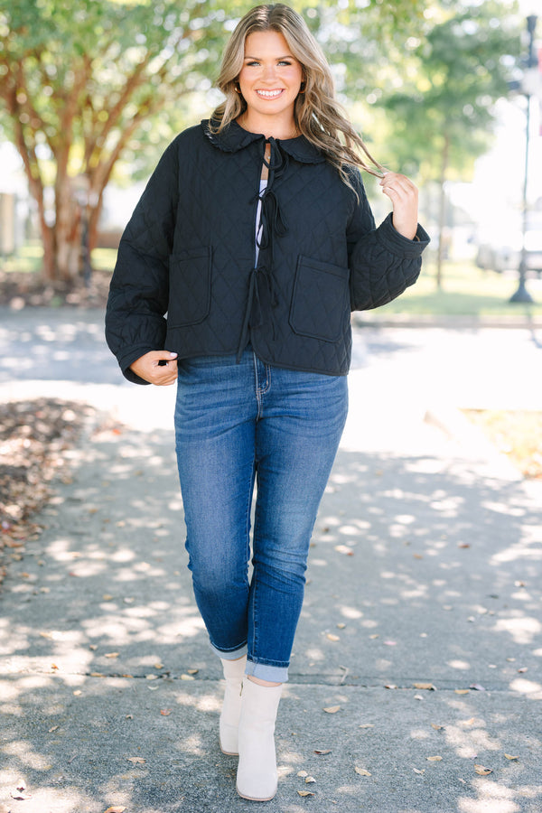 Plus Size black quilted jacket with a ruffled bib collar, three front bow ties, and patch pockets.