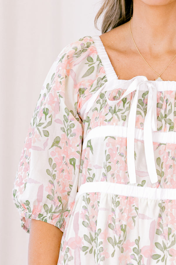 Chic Soul plus size clothing, white short bubble sleeve babydoll dress with light pink and sage green floral pattern and white ribbon bow on neckline