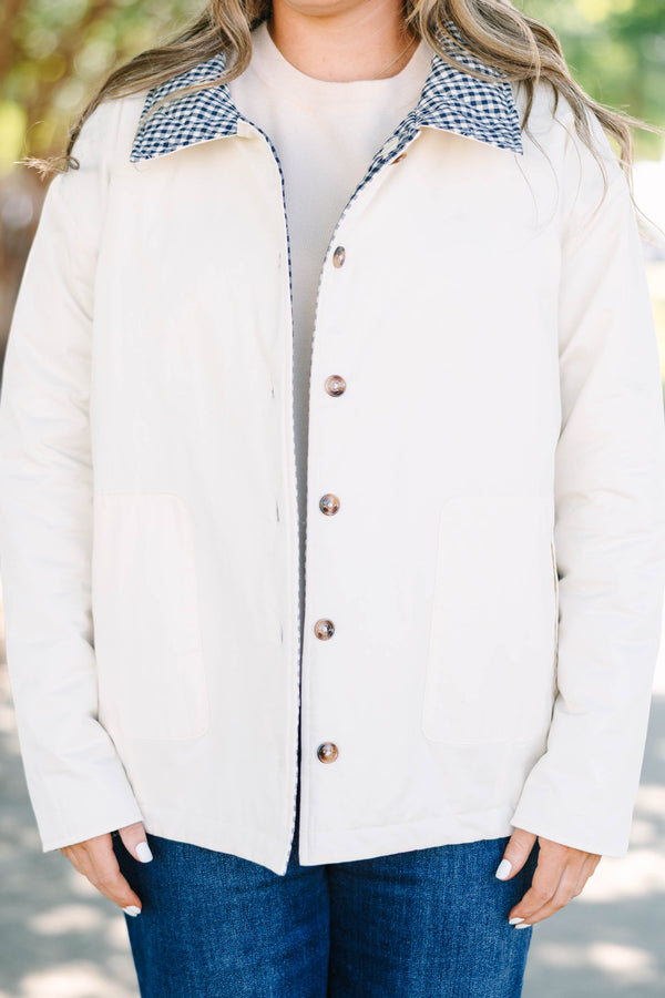 Plus size navy gingham reversible quilted coat with a taupe lining and button front.