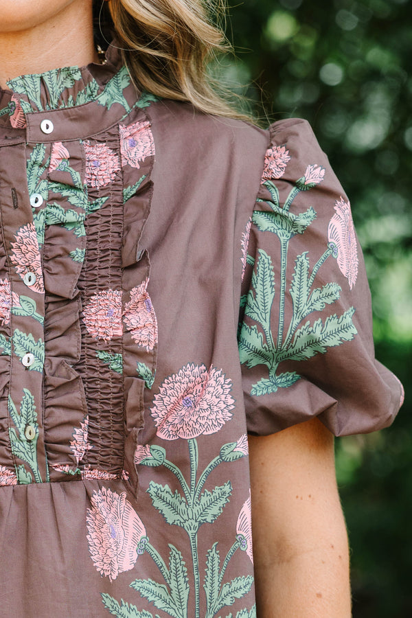 Plus size brown floral top with pink botanical print, ruffled high neck, and short puff sleeves.