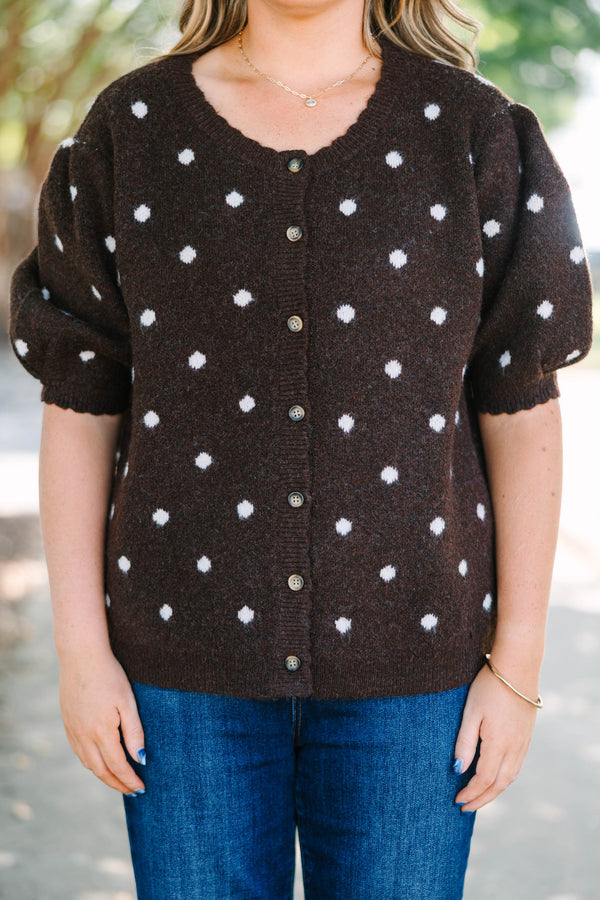 Plus Size brown cardigan with white polka dots, short puff sleeves, and a button-front closure.