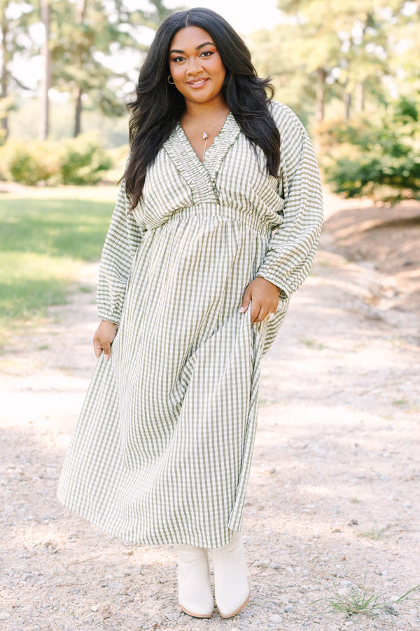 Plus size green and white plaid midi dress with a smocked waist, ruffle neckline, and flowy fit.