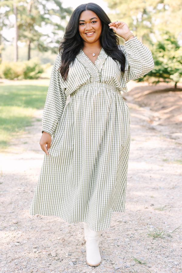 Plus size green and white plaid midi dress with a smocked waist, ruffle neckline, and flowy fit.