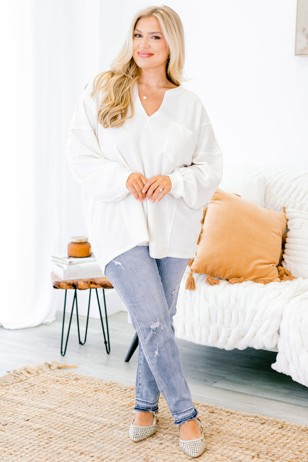 Chic Soul plus size clothing, light washed straight jeans with distressed details on each pant leg and small fringe details at the end of the jeans 