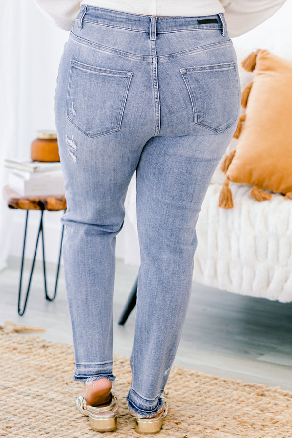 Chic Soul plus size clothing, light washed straight jeans with distressed details on each pant leg and small fringe details at the end of the jeans 