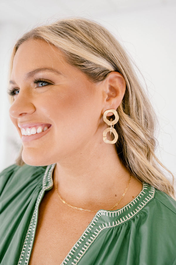 Chic Soul plus size clothing, gold dangle earing that has three hoops linking to one another 