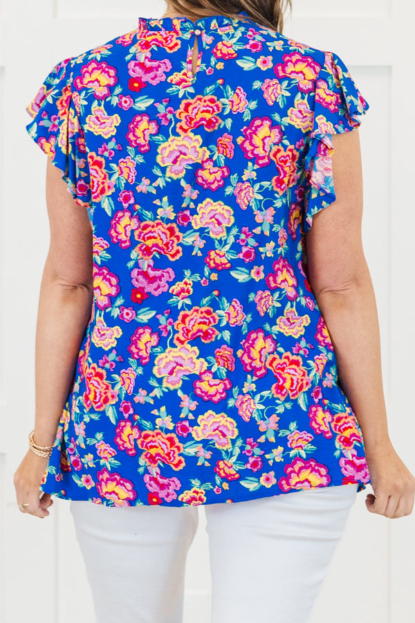Chic Soul plus size clothing, royal blue short sleeve top with ruffle round neckline with flutter ruffle sleeves with large multicolor pink floral print