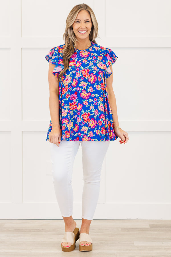 Chic Soul plus size clothing, royal blue short sleeve top with ruffle round neckline with flutter ruffle sleeves with large multicolor pink floral print