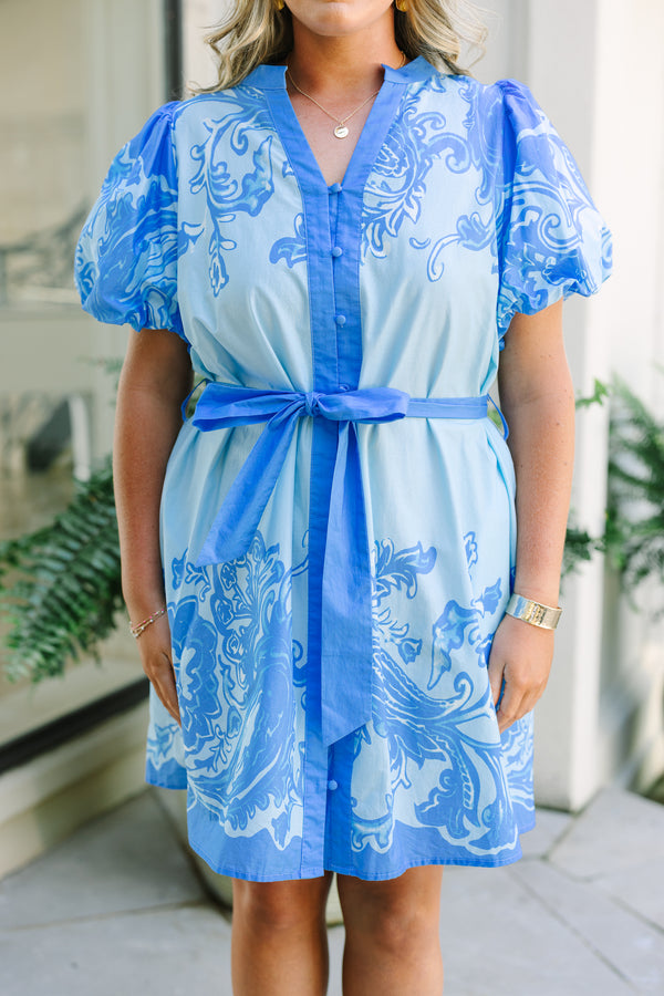 Plus Size blue mini dress with floral paisley print, puff sleeves, and a matching waist tie belt.