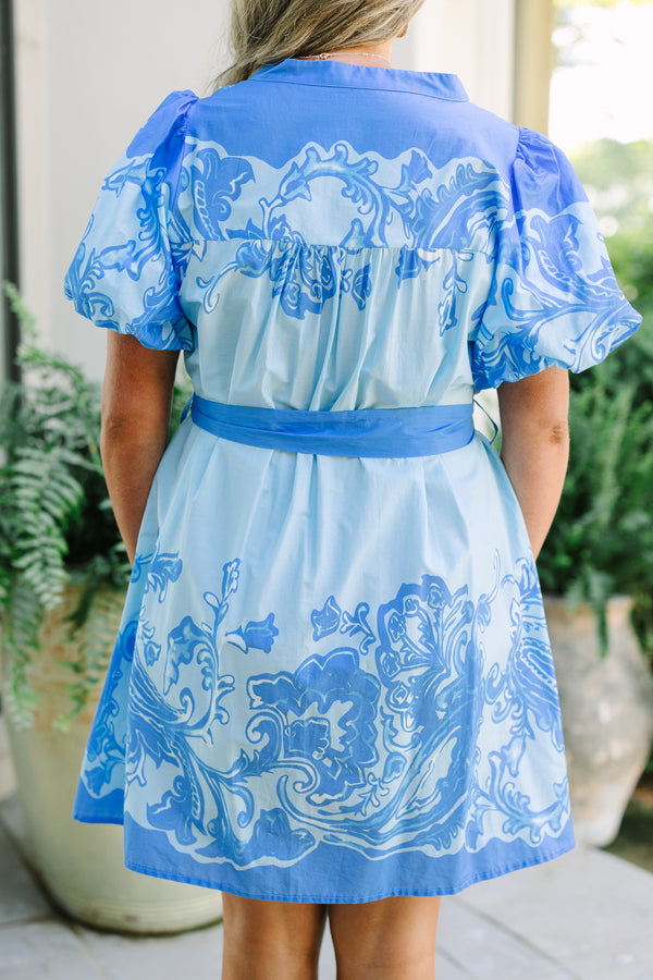 Plus Size blue mini dress with floral paisley print, puff sleeves, and a matching waist tie belt.