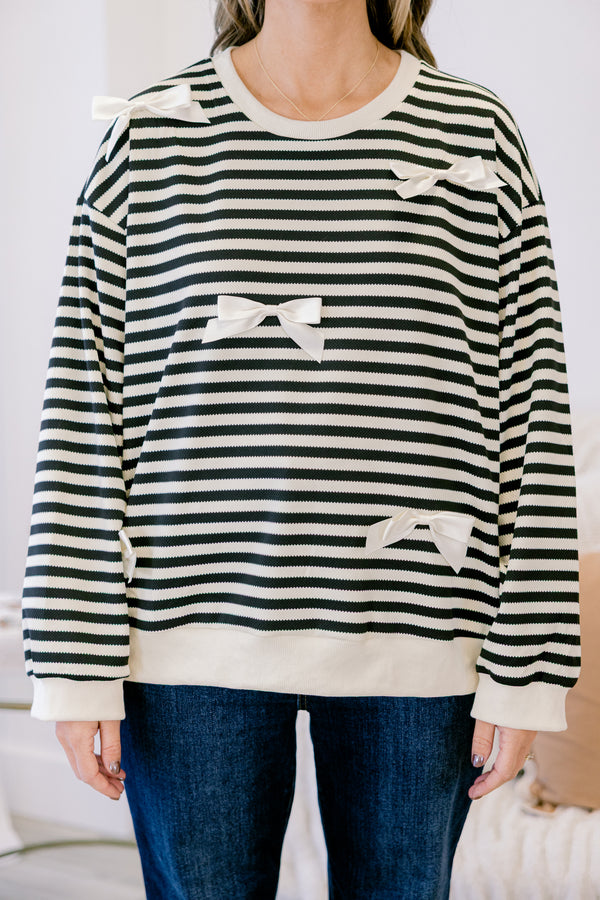 Chic Soul plus size clothing, black long sleeve pullover with white stripe pattern and ribbon bow detailing with round neckline and cuffed sleeves with white band along the bottom