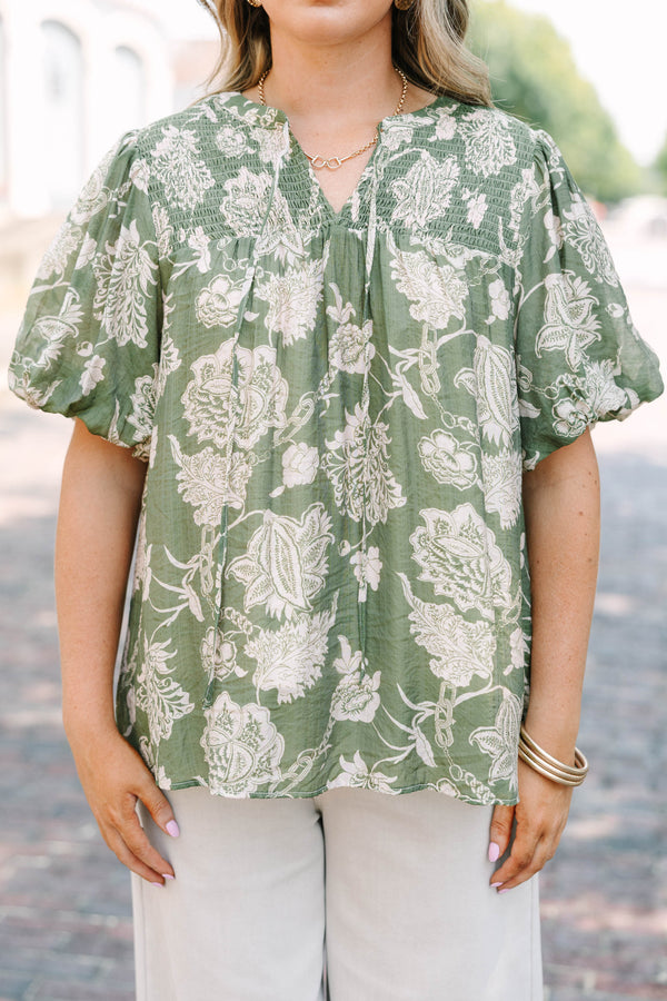 Plus Size green floral print top with elastic puff sleeves, split v-neck, and smocked shoulders.