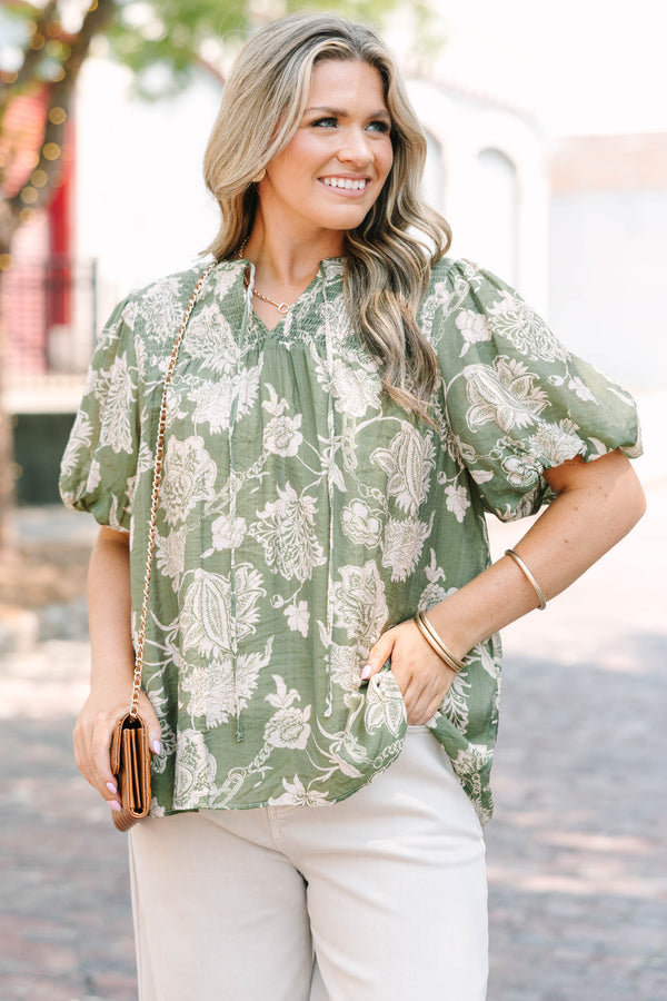 Plus Size green floral print top with elastic puff sleeves, split v-neck, and smocked shoulders.