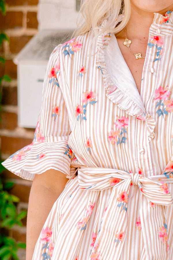 Chic Soul plus size clothing, beige striped dress with short sleeves that have a ruffle detail on the ends and a floral pattern throughout as well as a bow that ties around the waist 
