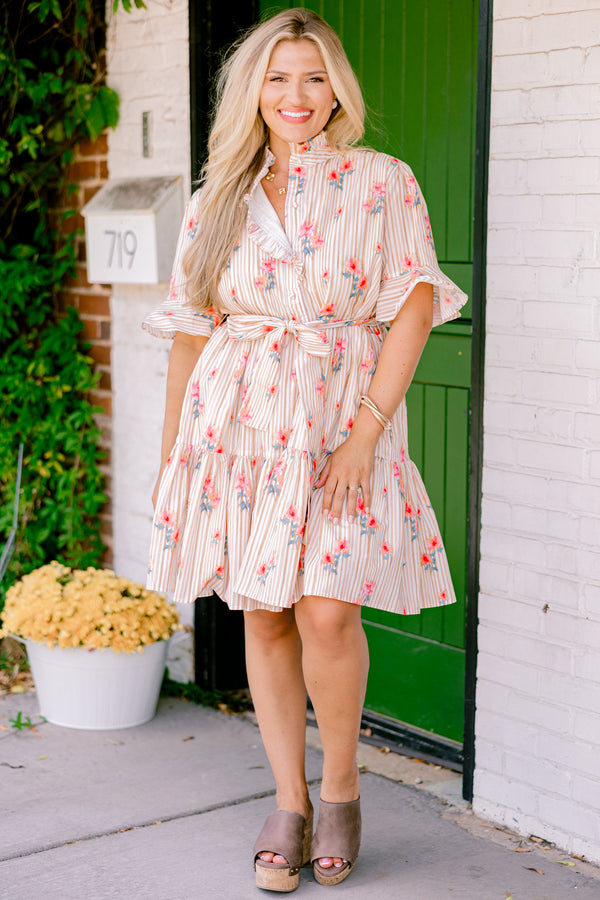 Chic Soul plus size clothing, beige striped dress with short sleeves that have a ruffle detail on the ends and a floral pattern throughout as well as a bow that ties around the waist 