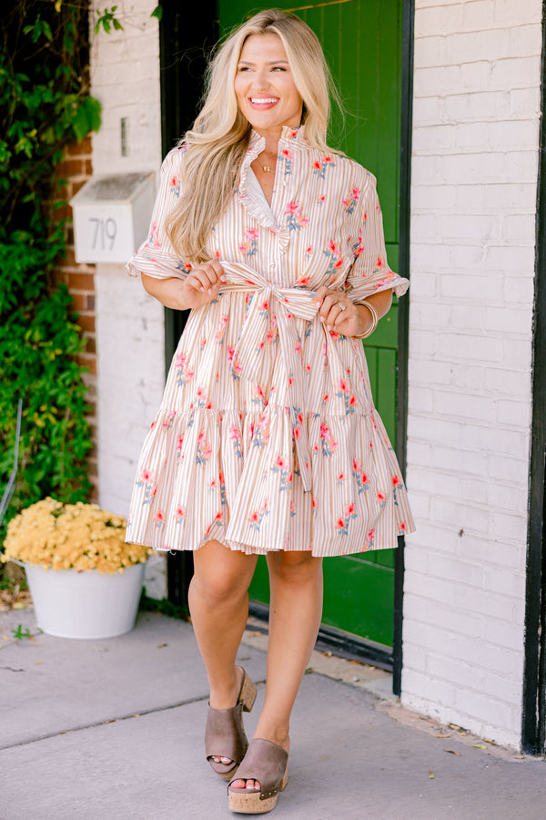 Chic Soul plus size clothing, beige striped dress with short sleeves that have a ruffle detail on the ends and a floral pattern throughout as well as a bow that ties around the waist 