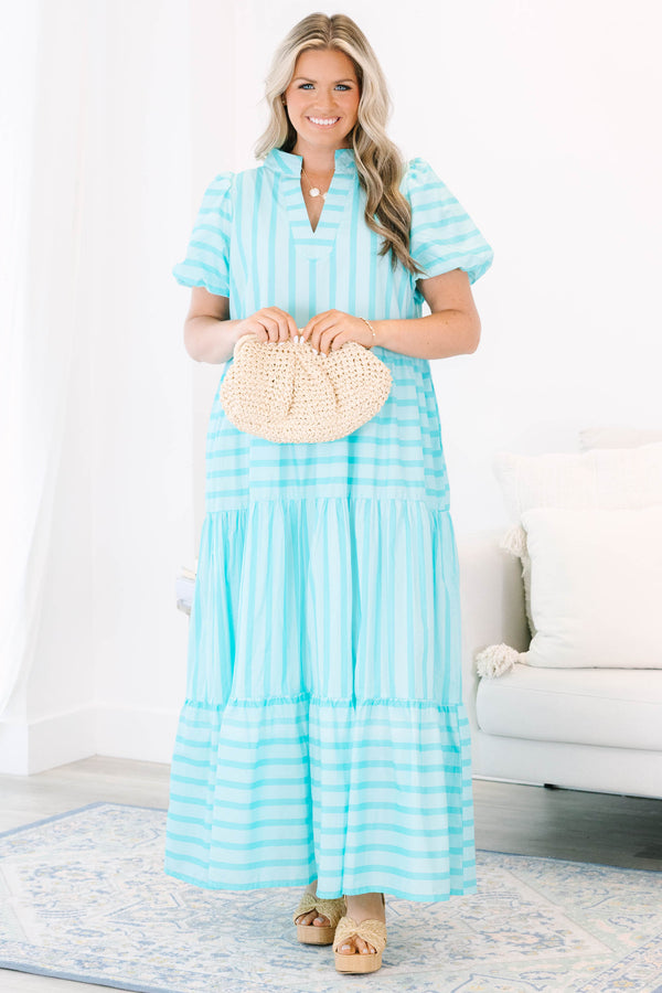 Plus Size turquoise striped maxi dress with a v-neckline, bubble sleeves, and a tiered skirt.