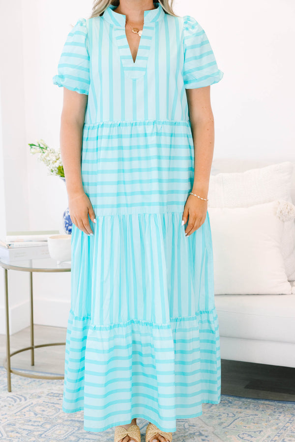 Plus Size turquoise striped maxi dress with a v-neckline, bubble sleeves, and a tiered skirt.