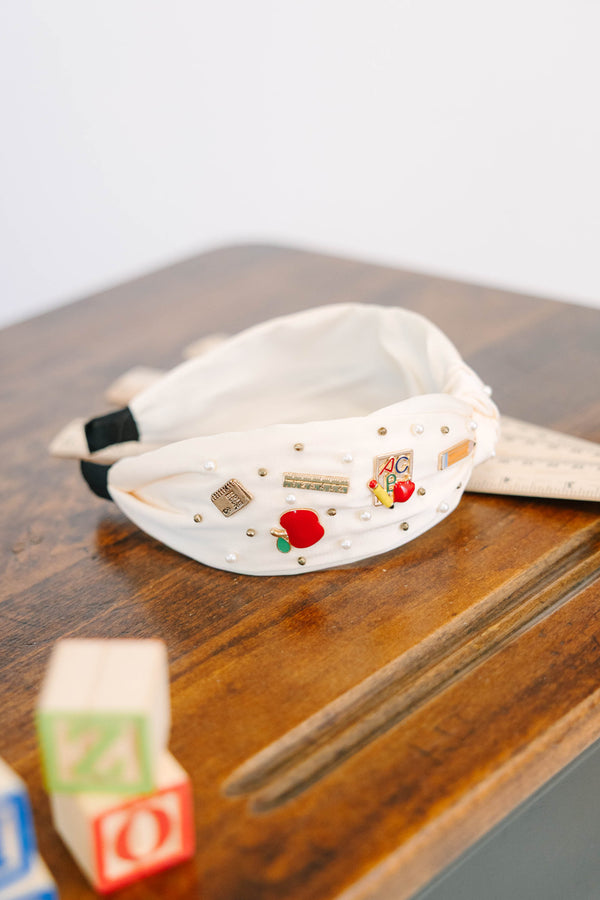 Plus Size cream top knot headband with school-themed charms like apples, books, and pearls.