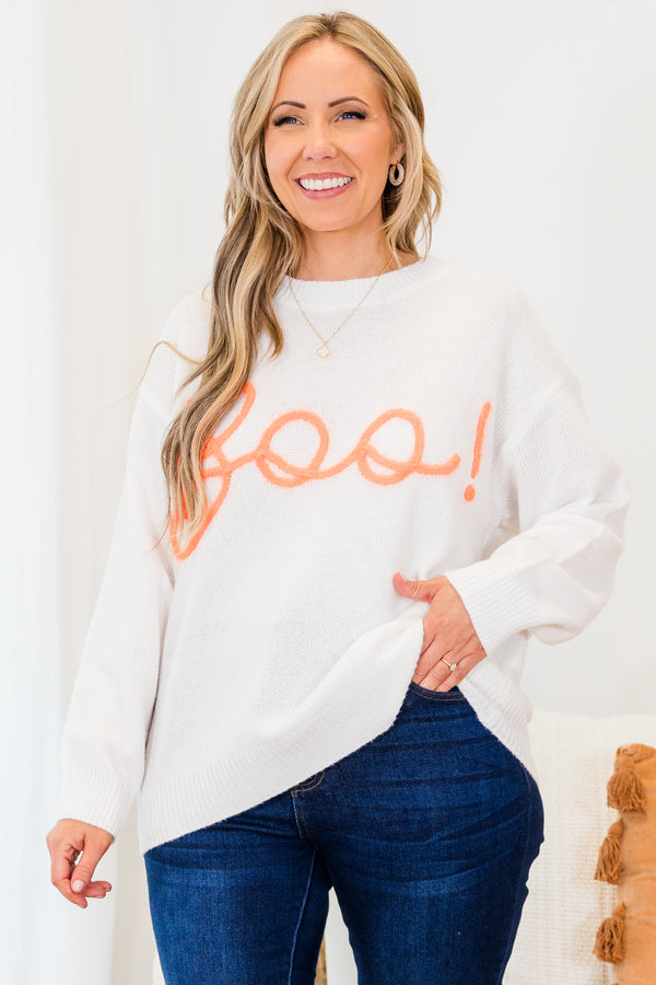 Chic Soul plus size clothing, long-sleeve crewneck white sweater with orange embroidery in cursive stating 
