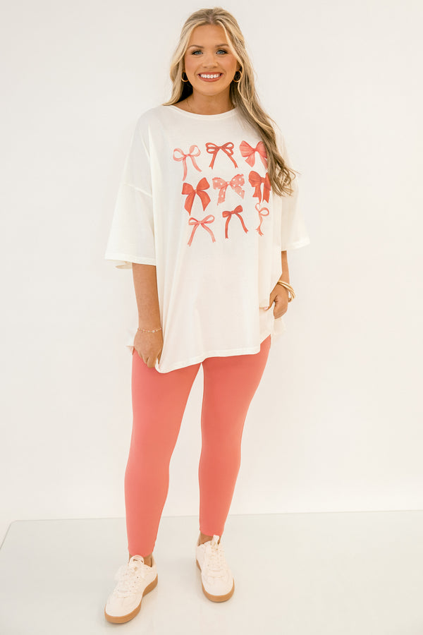 Chic Soul plus size clothing, white short sleeve boyfriend tee with multi style pink bows in grid like style on the front of the tee