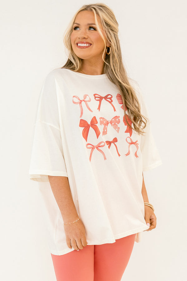 Chic Soul plus size clothing, white short sleeve boyfriend tee with multi style pink bows in grid like style on the front of the tee