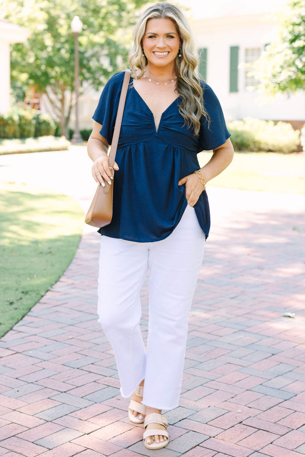Plus Size navy blue V-neck top with flutter sleeves, a gathered bust, and a flowy peplum hem.