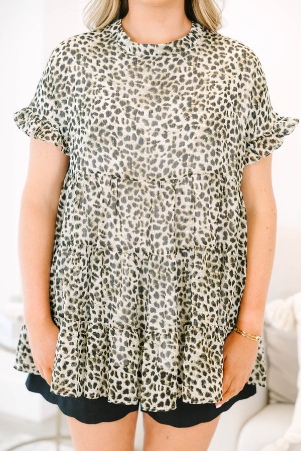 Plus size leopard print top with a flowy tiered silhouette and ruffle short sleeves.