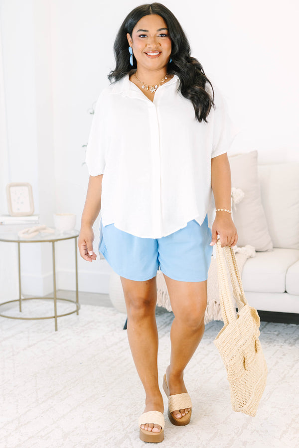 Plus size flowy short-sleeve button-down top with a relaxed fit.